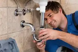 Woman speaking with plumber